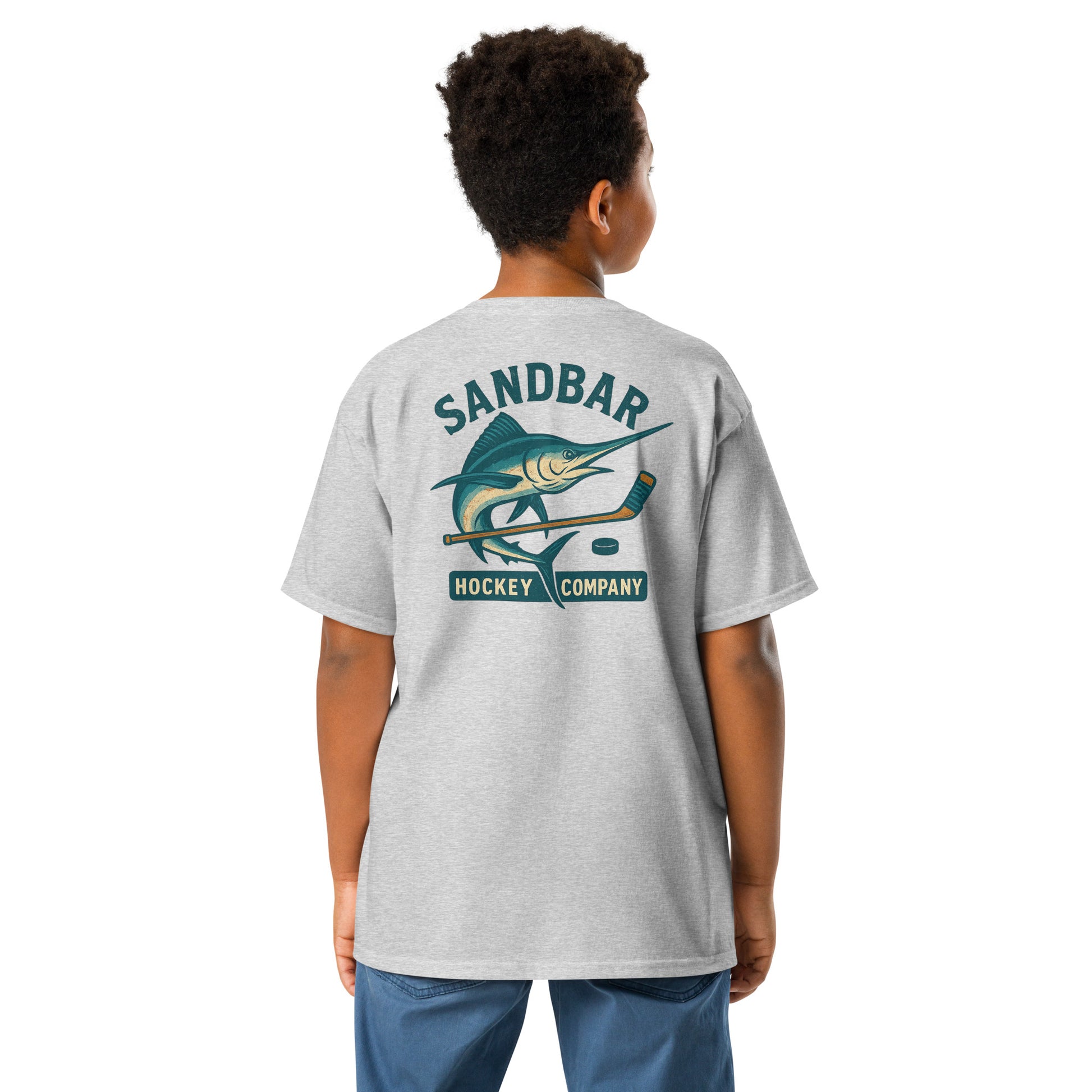 Grey youth hockey t-shirt back side on model with marlin and hockey stick graphic and Sandbar Hockey Company text