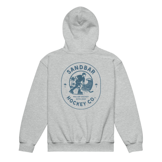 Grey youth roller hockey hoodie back side with large circular roller hockey graphic featuring skater, ocean wave, palm trees, and Sandbar Hockey Co. text
