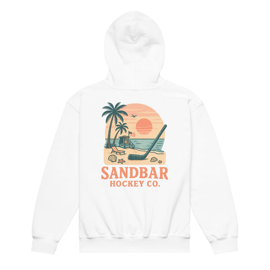 White youth hockey hoodie back side with beach sunset graphic, palm trees, lifeguard stand, hockey stick, and Sandbar Hockey Co. text